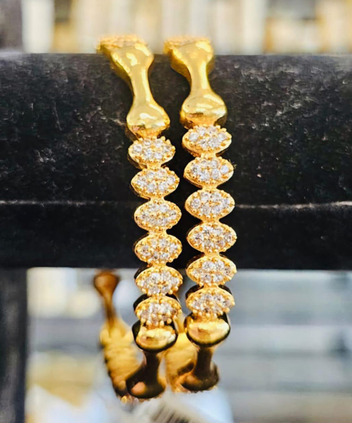 White stone bangle with floral gold plated designs